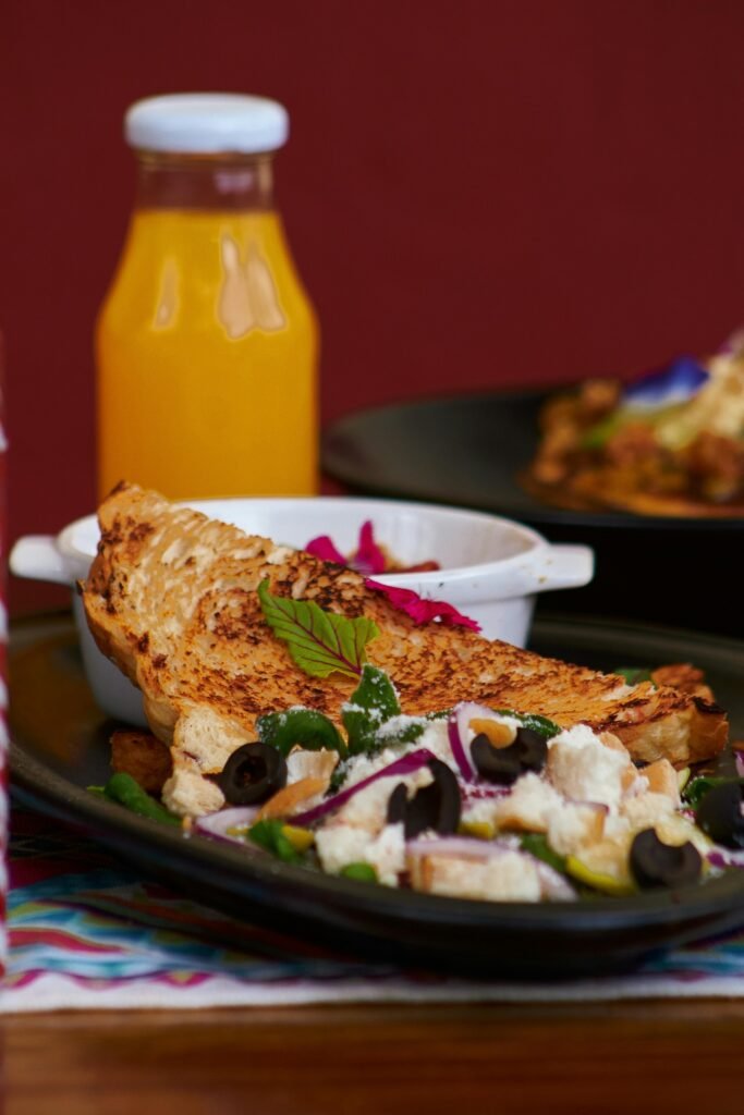 pexels-photo-32689235-32689235 Mexican dish with fresh ingredients and juice on a wooden table, ideal for food lovers.